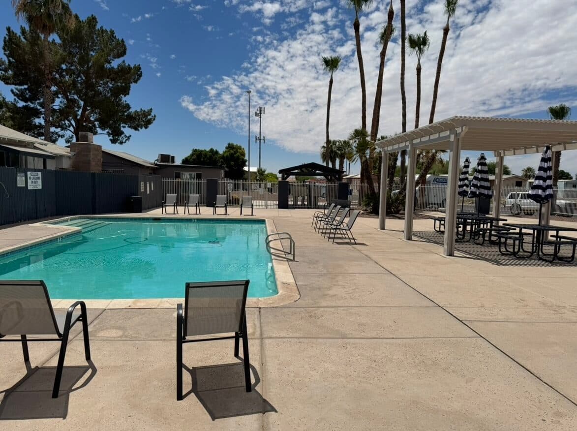 The pool deck at Sierra Pacific, with loungers and palms.